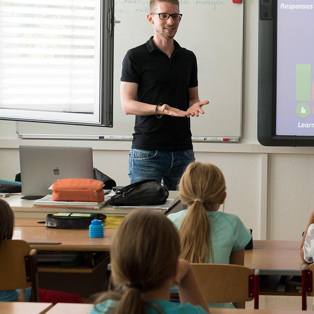 teacher leading a classroom lesson